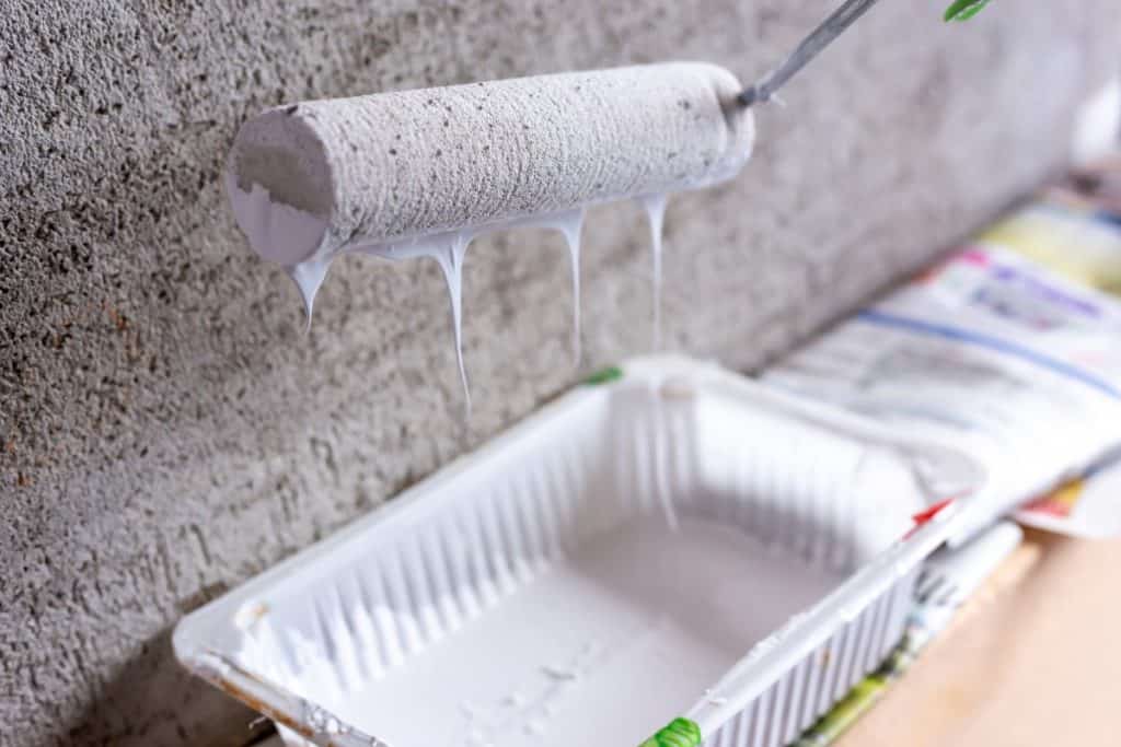 Priming concrete wall before painting