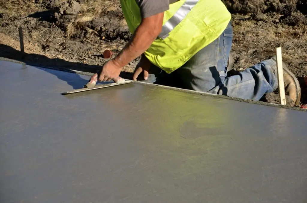 Concrete worker installing a concrete driver