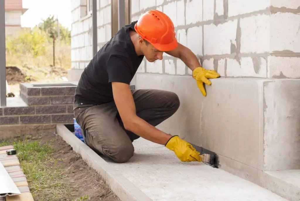 Man working with finish on concrete