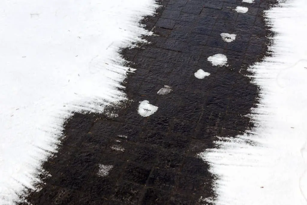 Concrete walkway covered in snow