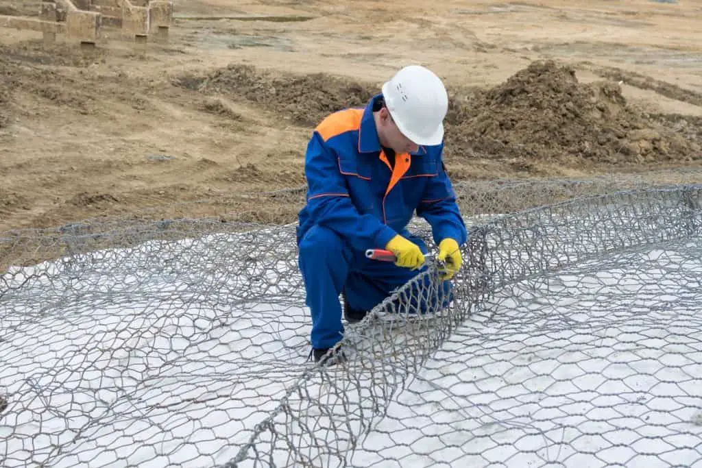 Concrete worker preparing mesh