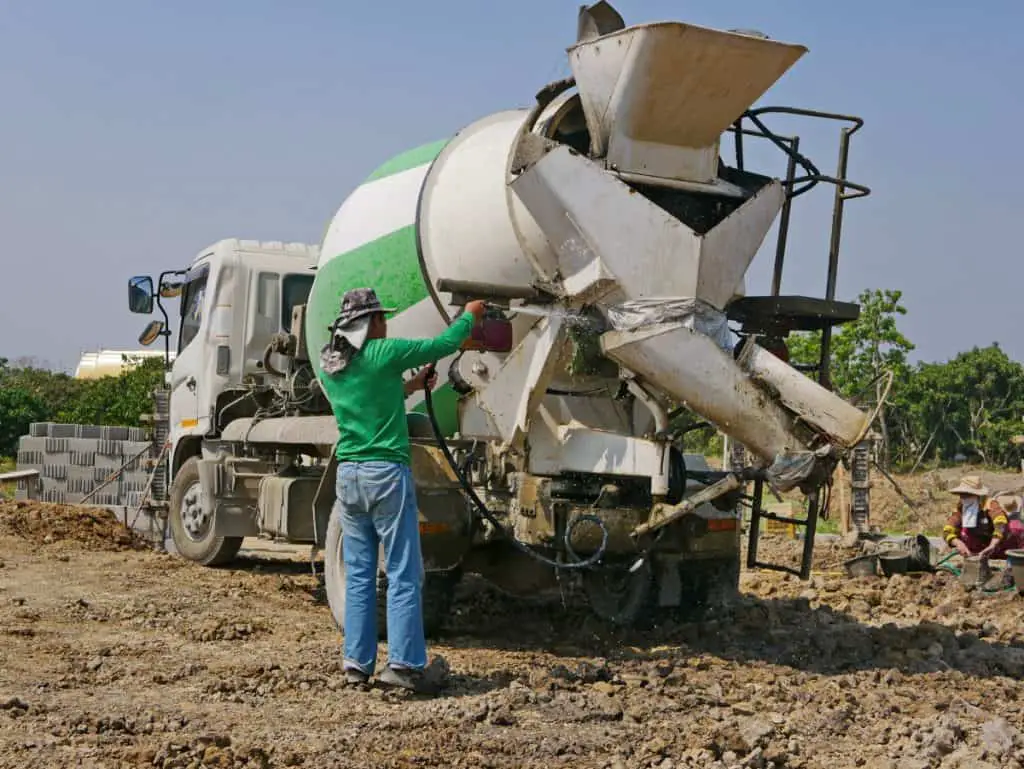 Man washing a concrete truck