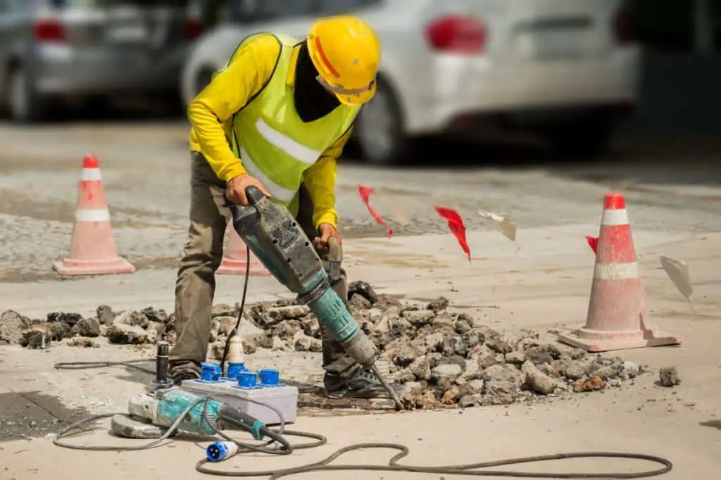 Man removing old concrete