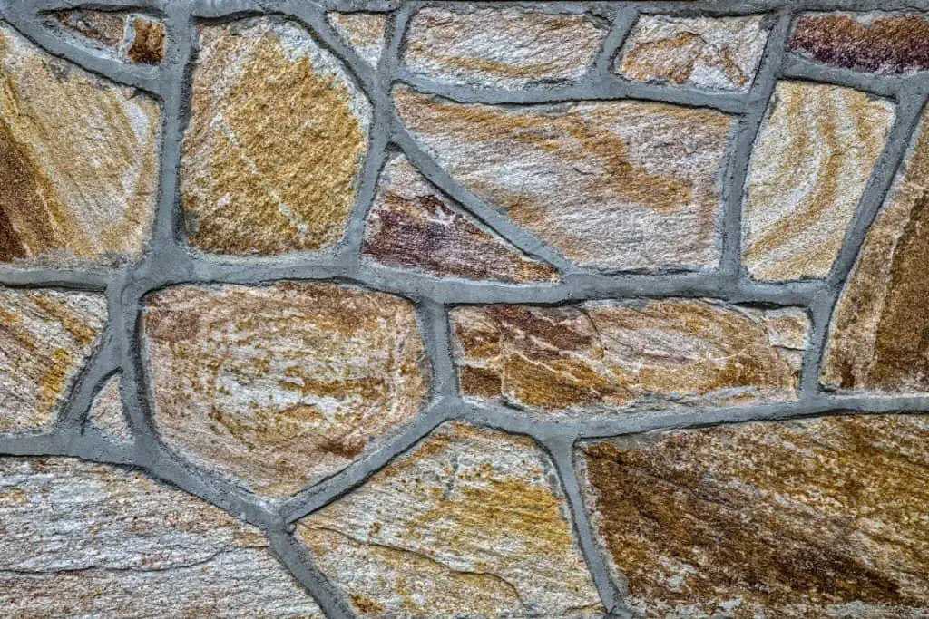 Veeners of stone covering a concrete wall