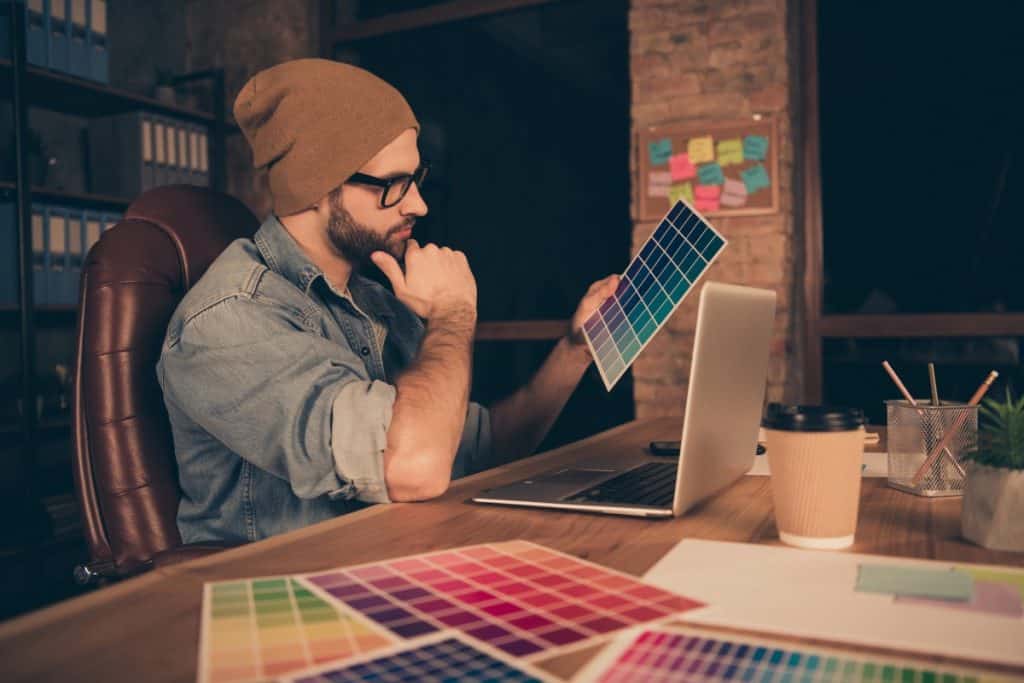 Man choosing the color for his concrete acid stain  