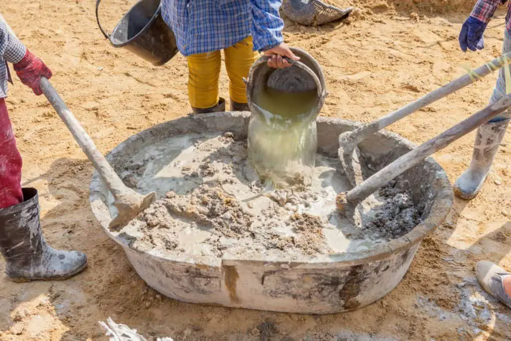 Contractors mixing concrete