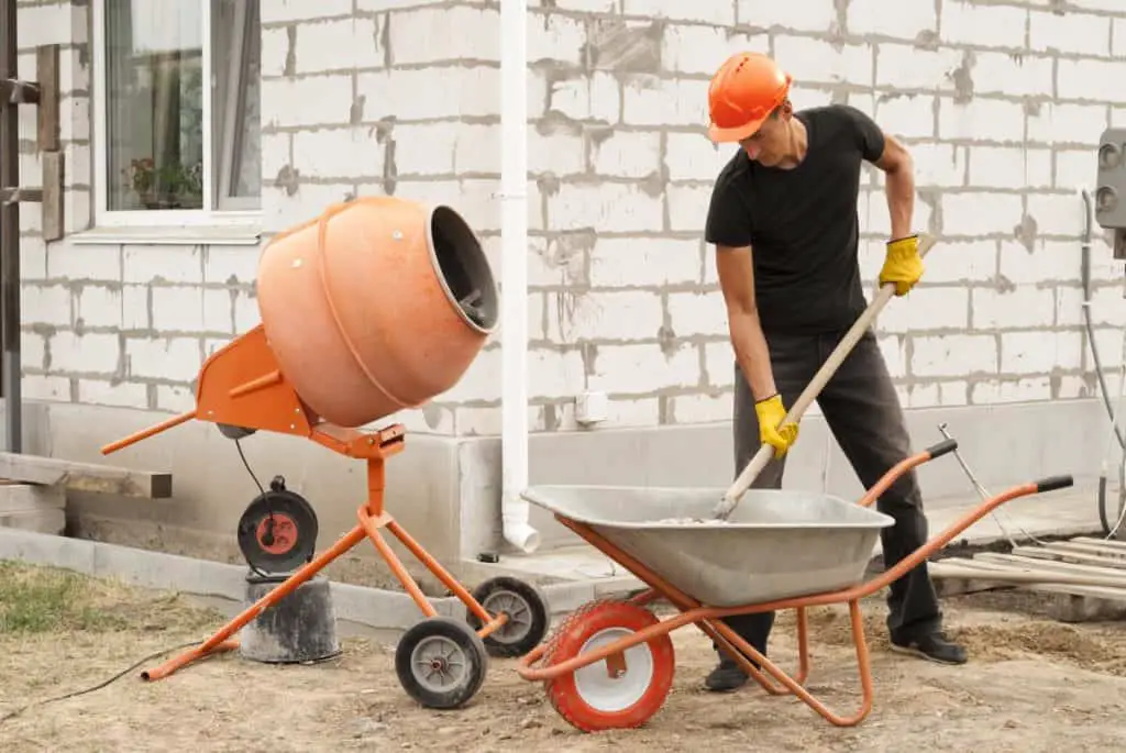 Man mixing large quantities of concrete