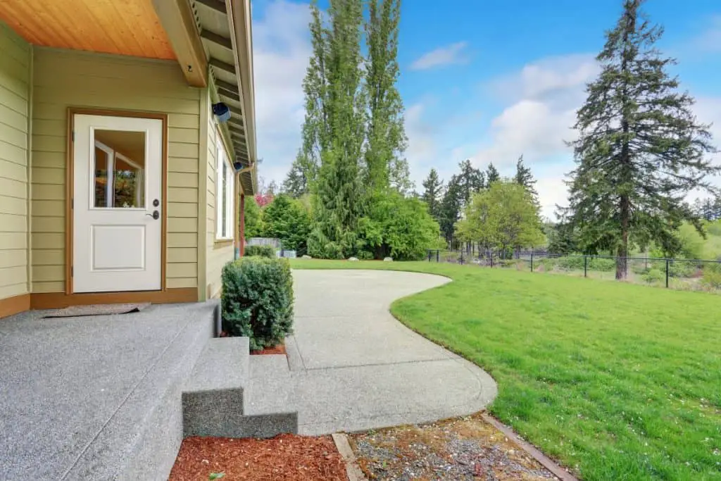 Concrete patio that is flush with the grass