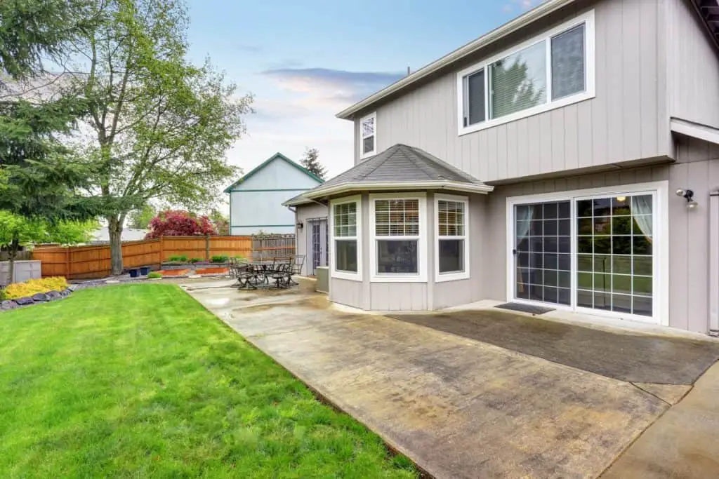 Concrete patio next to grass