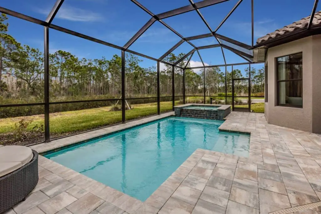 Pool deck with stamped and stained concrete instead of pavers