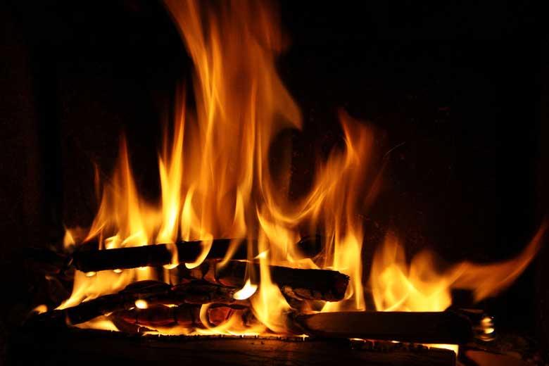 Fire burning in concrete fireplace