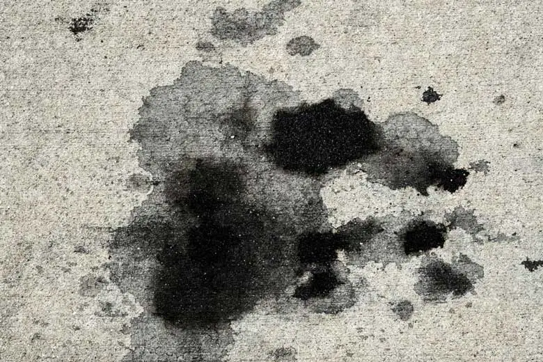 Oil stain on concrete driveway